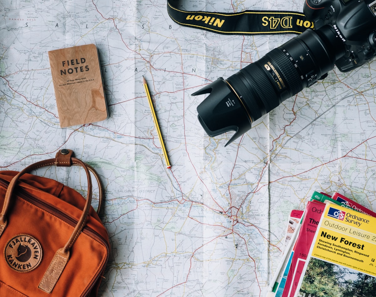 Travel planning at a desk with map